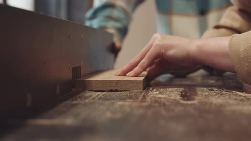 Adult Helping with Woodworking Machine Close Up