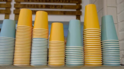 Stacks of Colorful Paper Cups Ready for Use