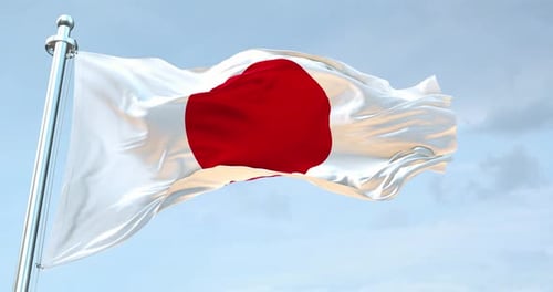 Realistic Waving Japan Flag Against Blue Sky