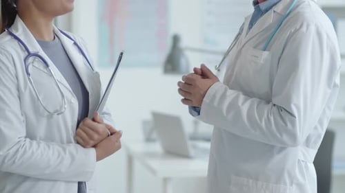 Doctors Discussing Medical Issue in Clinic