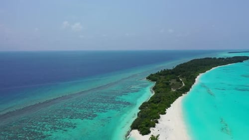 Aerial drone shot seascape of idyllic tourist beach lifestyle by blue ocean and white sand backgroun