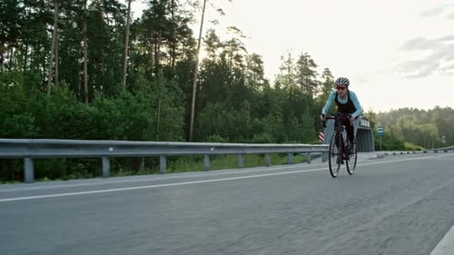Tired Female Cyclist Riding Bicycle