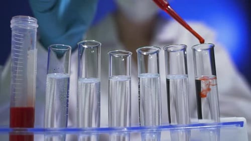 Lab Analysis with Test Tubes and Red Liquid