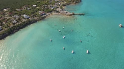 Aerial drone view of a fishing motor boat in the Bahamas, Caribbean.
