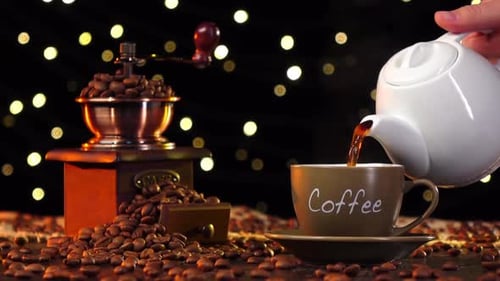 Pouring Fresh Hot Coffee Into a Cup