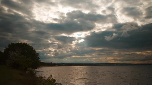 Beautiful Sunset with Clouds and Sea with Beach Time Lapse