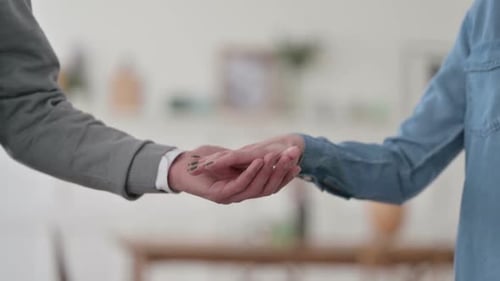 Close Up of Couple Holding Hands