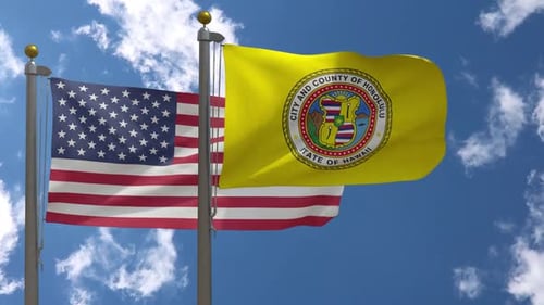 United States and Honolulu Flags Waving on Flagpoles Under Blue Sky