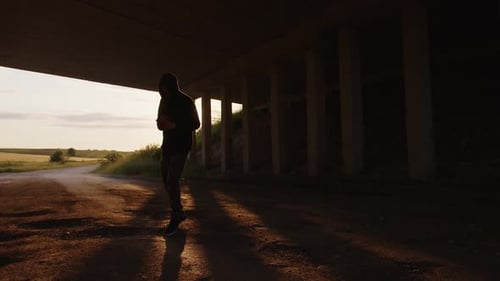 Hooded Boxer Shadow Boxing at Sunrise