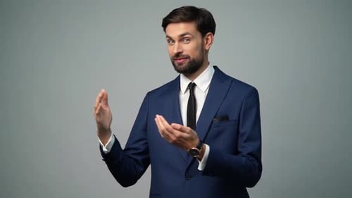 Handsome Man in Suit Presenting Information