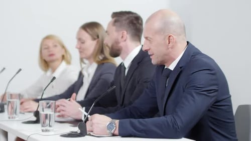 Panel of Professionals Talking at Press Conference