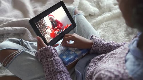 Women connecting on Tablet during Christmas Holiday