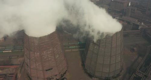 Epic Aerial of High Pipes with Smoke Emission. Plant Pipes Pollute Atmosphere. Industrial Factory
