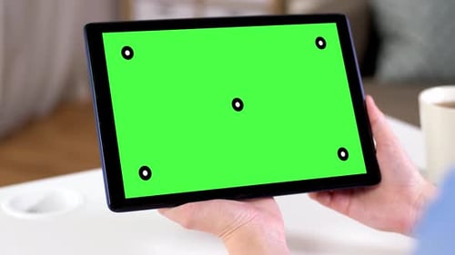Hands Holding Tablet Pc with Green Screen at Home 109