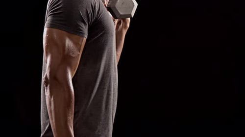 Man Working Out Biceps with Dumbbells