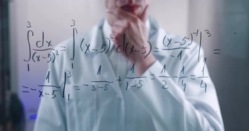 Man Scientist Thinks Over the Solution of the Integral Equation Drawn on a Glass Board in a
