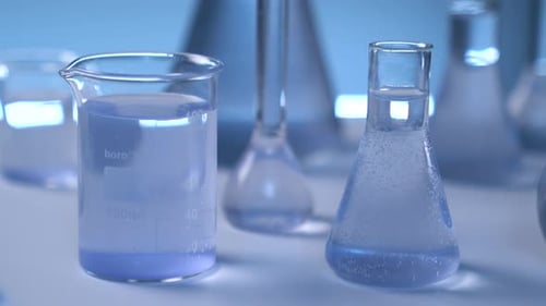 Laboratory Glassware with Bubbles and Blue Liquid