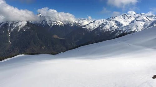 Fly Towards the High Altitude Mountains Through Pristine Snow
