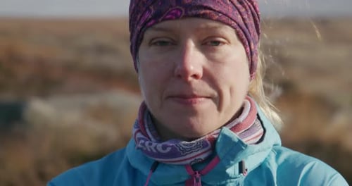 Smiling Woman Wearing a Headband Outdoors