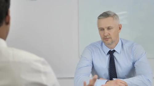 Two Men Meet in an Office Environment