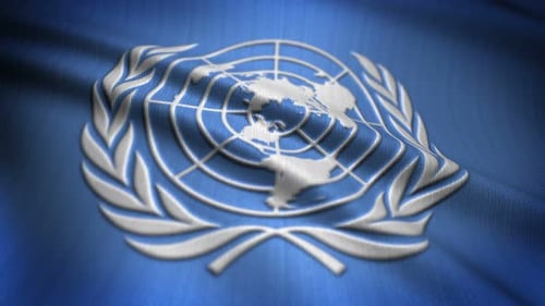 United Nations Emblem on Realistic Waving Blue Fabric