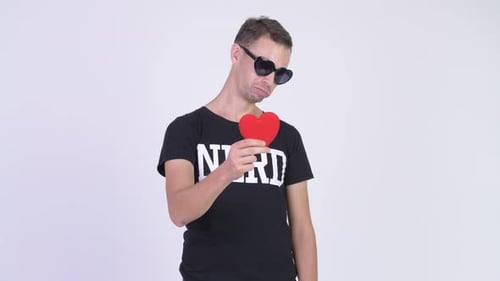 Studio Shot of Happy Nerd Man Giving Red Heart Ready for Valentine's Day