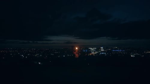 Young Blond Male Spins Burning Torch Breathes Out Large Stream of Fire Makes Fireball Touches Burned