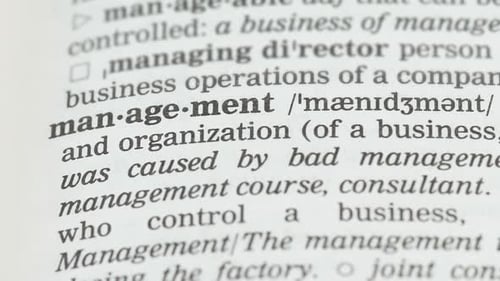 Management Definition Underlined in Dictionary Close Up