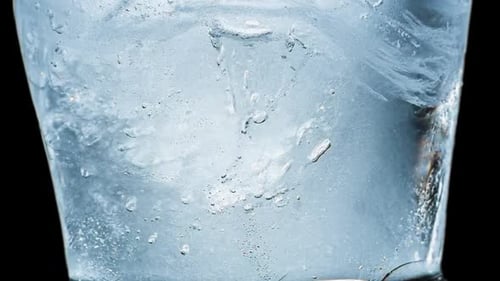 Glass with Ice Cubes Close Up Shot
