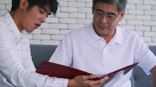 Advisor Explains Documents to Client at Home