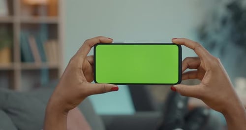 Woman Using Smartphone with Chroma Key Screen