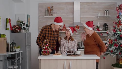 Family Christmas Celebration with Gifts in Cozy Kitchen