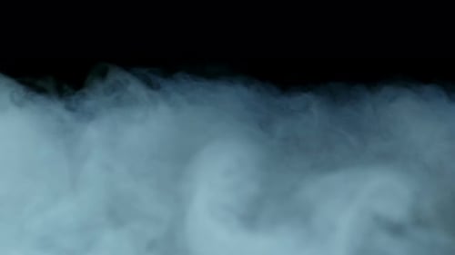 Abstract Blue Smoke Flowing on Black Background