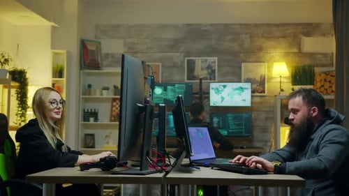 Tech Workers Coding and Collaborating in Office at Night