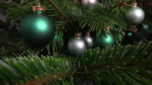 Decorated Christmas Tree with Green and Silver Baubles