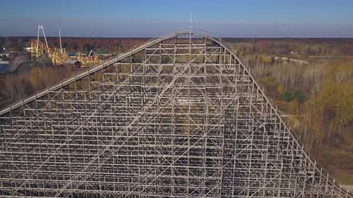 Aerial push-out of rollercoaster at shut down amusement park, Michigan