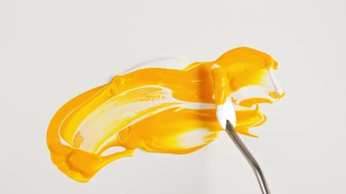 Artist Mixing Ingredients Watercolor Using Palette Knife and Pigments on White Background