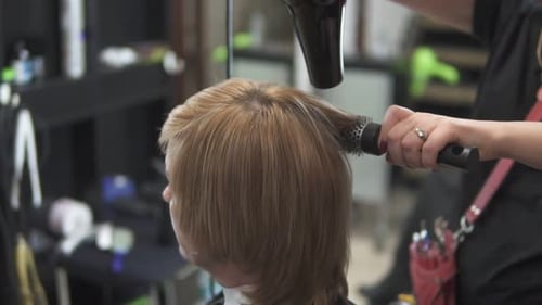 Woman Gets Hair Blowout at Salon