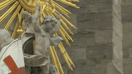 Weathered Angel Statue with Golden Sunburst Decoration