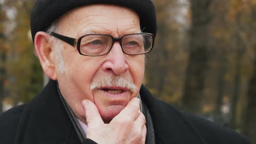 Senior Man Contemplating with Hand on Chin