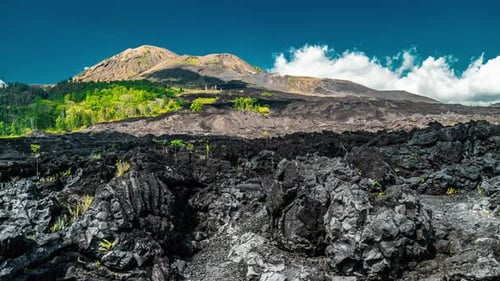 Dramatic View of the Black Lava at the Volcano Batur in Bali, Indonesia. Timelapse