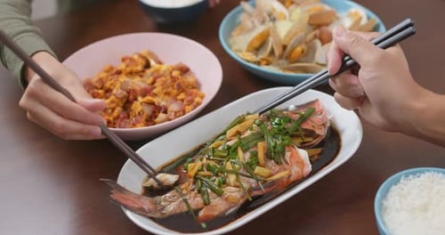 Home cooking with steamed fish, fry egg of pork and fry of clam