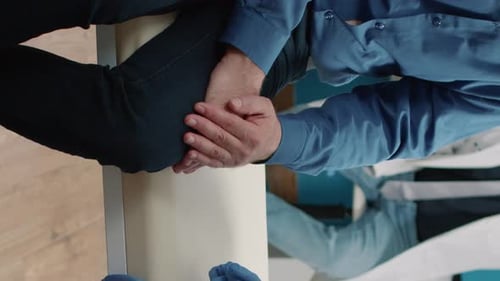 Doctor Holding Patient's Hands for Reassurance