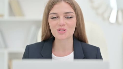 Close Up of Cheerful Businesswoman Doing Video Chat on Laptop