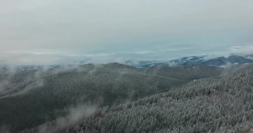 Aerial View. Scenic Mountain Landscape on a Winter Day, Fog in the Low Areas.