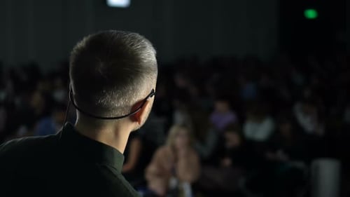 Male Public Narrator Talking at Conference Hall