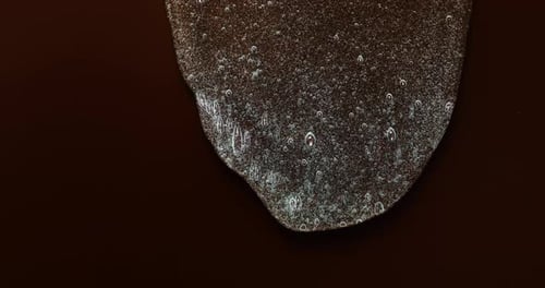 Abstract Bubbling Metallic Liquid on Blank Backdrop