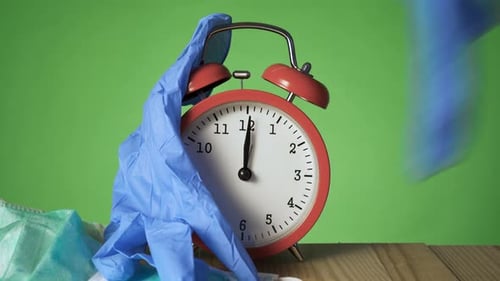 Ringing Alarm Clock with Medical Gloves and Masks