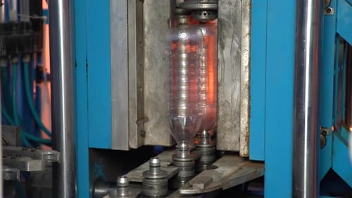 Plastic Bottle Manufacturing Machine in Factory Setting