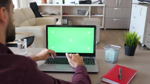Man Typing on Computer with Green Screen Chroma Mock Up